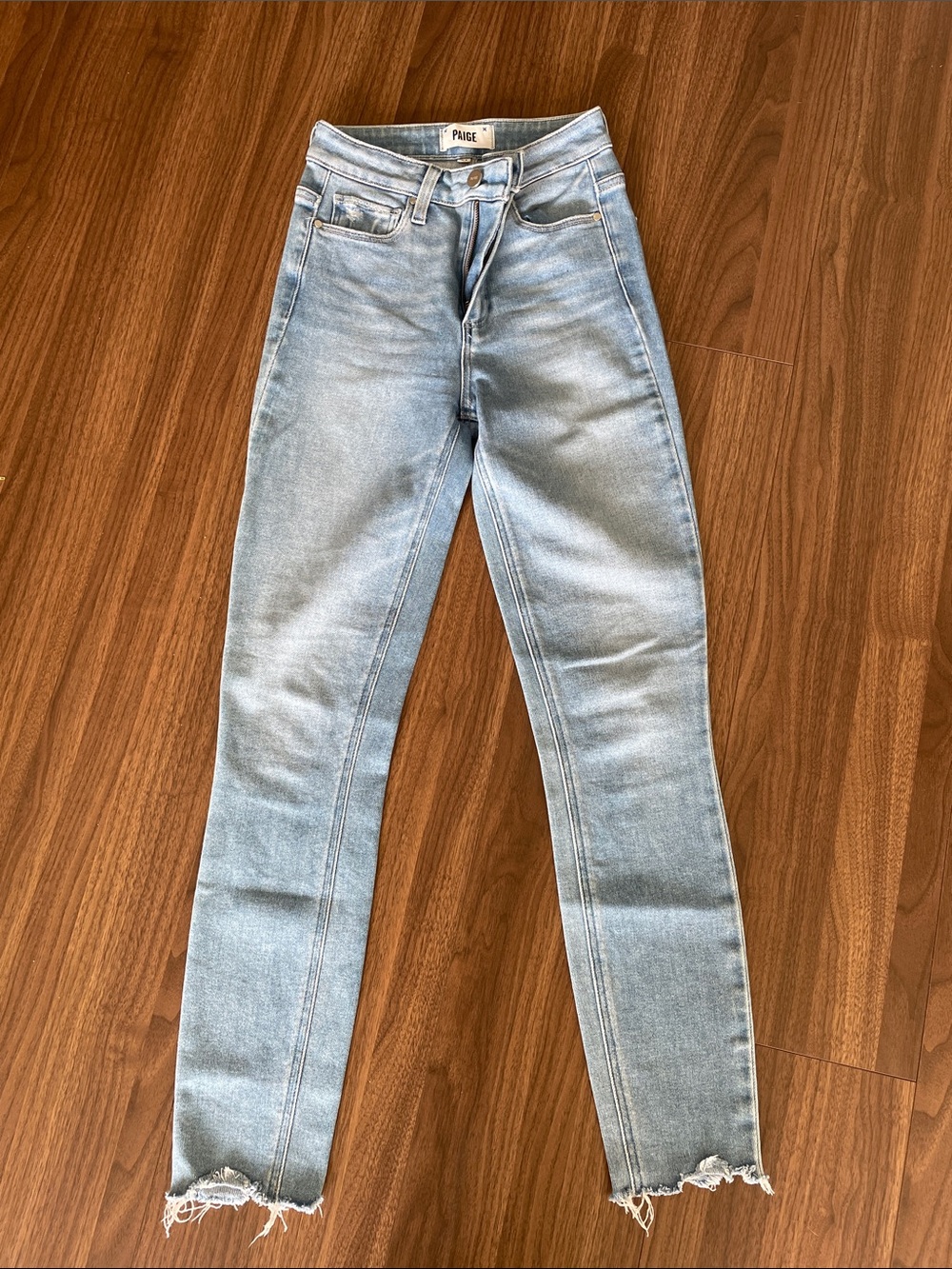 PAIGE Faded Light Blue High-Rise Skinny Jeans with Raw Hem